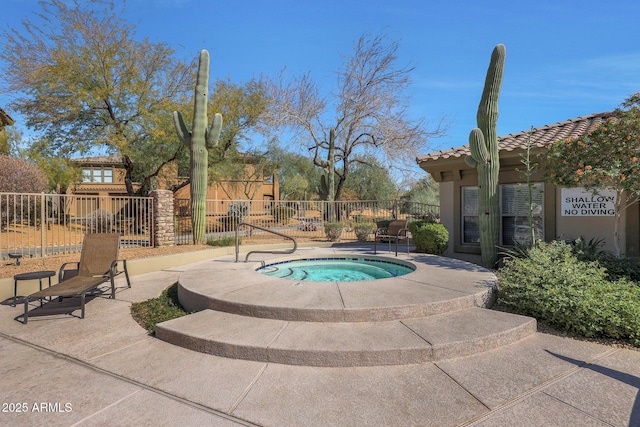 view of pool featuring a hot tub and a patio area