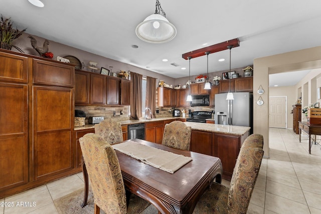 tiled dining area featuring sink