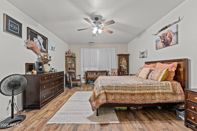 bedroom featuring ceiling fan and light hardwood / wood-style floors