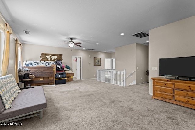 living room featuring ceiling fan and carpet