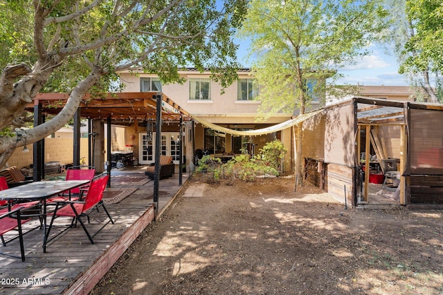 back of property with a wooden deck