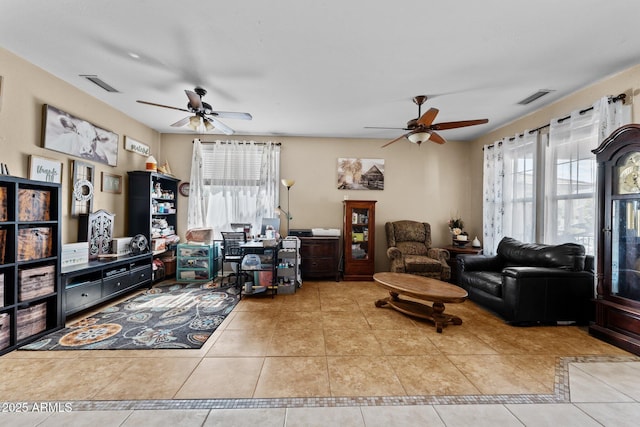 tiled living room with ceiling fan