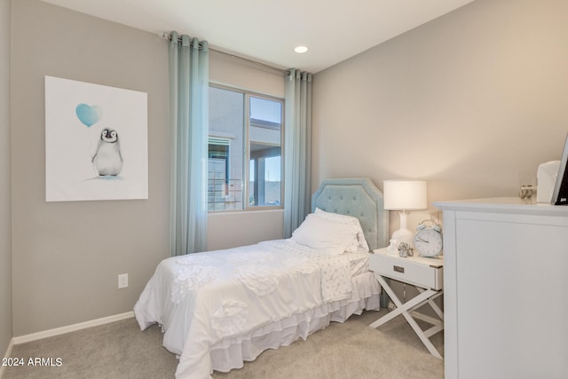 bedroom featuring light carpet