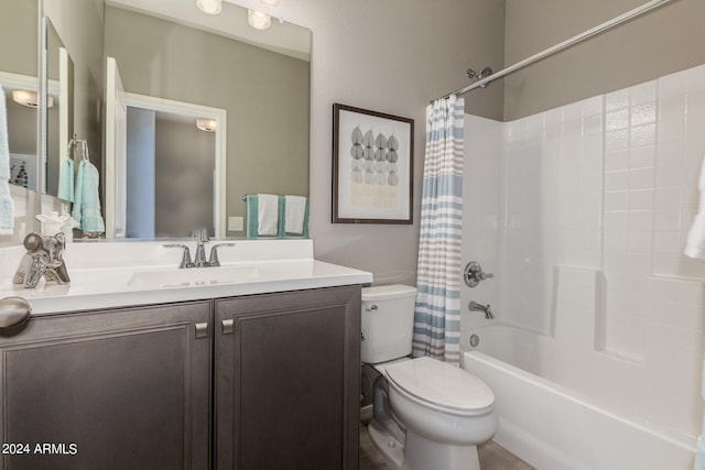 full bathroom featuring toilet, vanity, and shower / tub combo with curtain