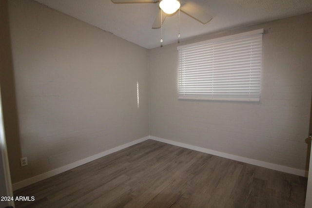 5918 S Grover Cyn Rd, Claypool, AZ 85532 - unfurnished room with wood finished floors, baseboards, and ceiling fan