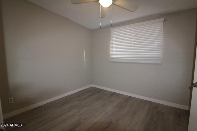 5918 S Grover Cyn Rd, Claypool, AZ 85532 - unfurnished room featuring wood finished floors, a ceiling fan, and baseboards