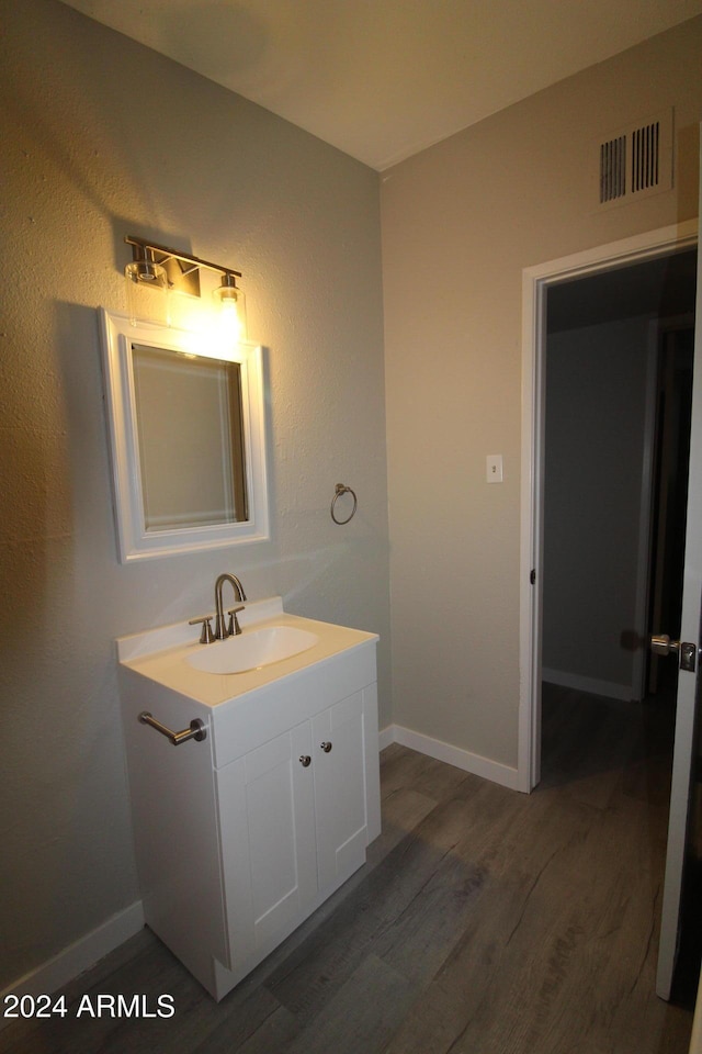5918 S Grover Cyn Rd, Claypool, AZ 85532 - bathroom with vanity, wood finished floors, and baseboards