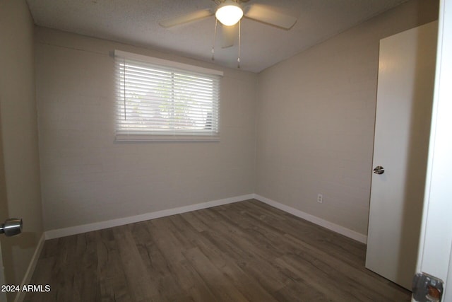 5918 S Grover Cyn Rd, Claypool, AZ 85532 - unfurnished room featuring wood finished floors, a ceiling fan, and baseboards