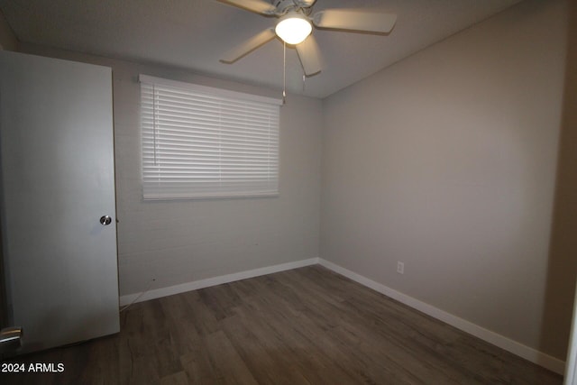 5918 S Grover Cyn Rd, Claypool, AZ 85532 - empty room featuring wood finished floors, ceiling fan, and baseboards
