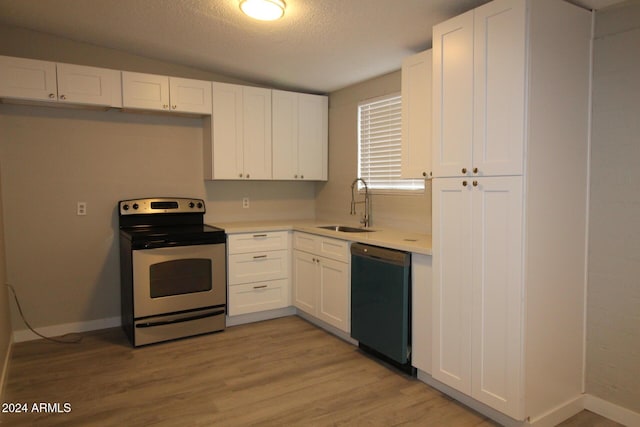 5918 S Grover Cyn Rd, Claypool, AZ 85532 - kitchen with dishwasher, electric range, a sink, white cabinetry, and light countertops