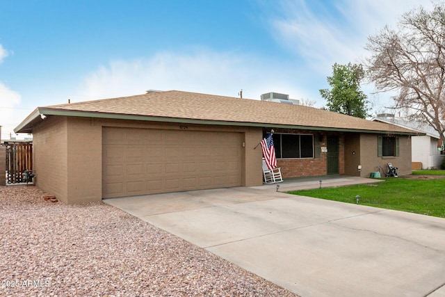 ranch-style house with a garage, concrete driveway, brick siding, and a shingled roof