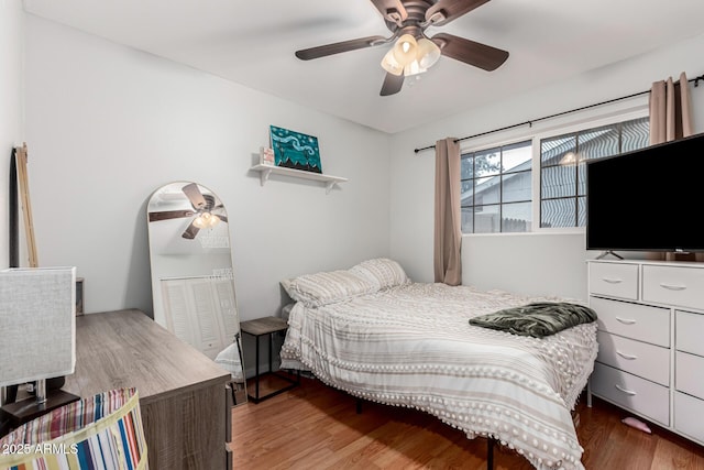 bedroom featuring wood finished floors and a ceiling fan