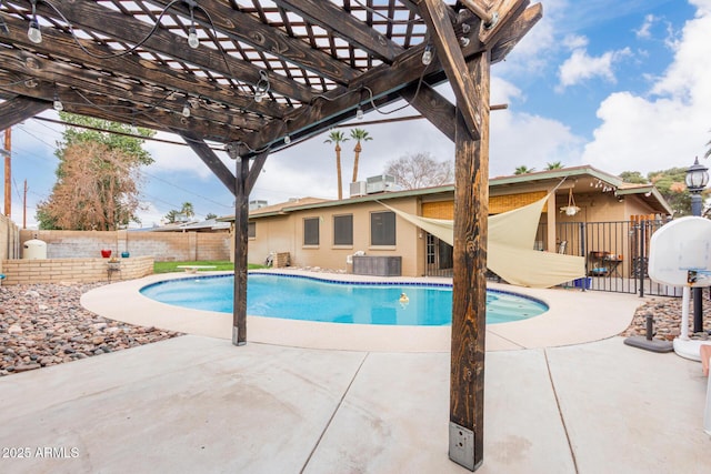 view of swimming pool featuring central AC unit, a fenced backyard, a fenced in pool, a pergola, and a patio area