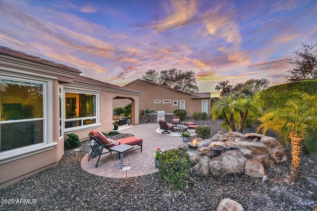 exterior space featuring a fire pit and a patio area