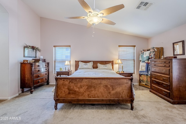 carpeted bedroom featuring lofted ceiling and ceiling fan