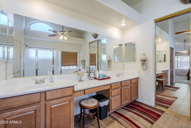 bathroom featuring an enclosed shower, ceiling fan, tile patterned floors, and vanity