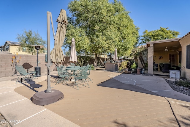 view of patio featuring ceiling fan