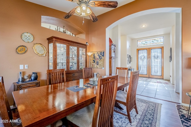 dining space featuring french doors, ceiling fan, and hardwood / wood-style flooring