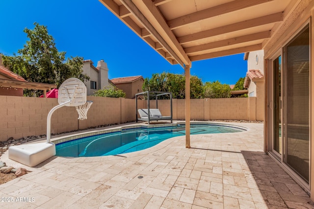 view of swimming pool with a fenced in pool, a patio, and a fenced backyard