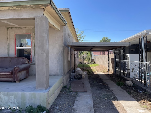 view of home's exterior featuring a carport