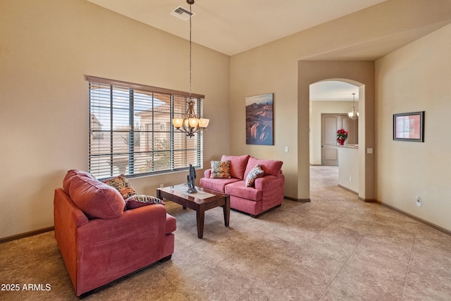 living room featuring a notable chandelier