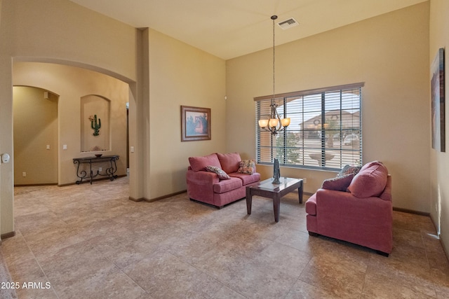 living room featuring an inviting chandelier