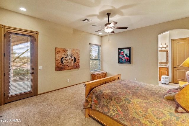 carpeted bedroom with ceiling fan, connected bathroom, and access to outside