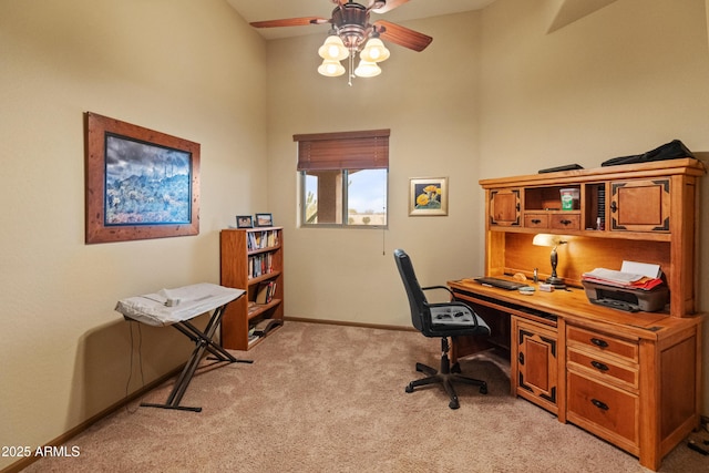 office space with ceiling fan and light colored carpet