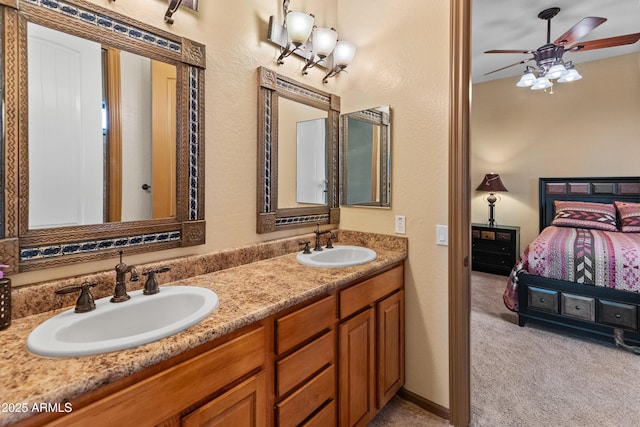 bathroom with ceiling fan and vanity