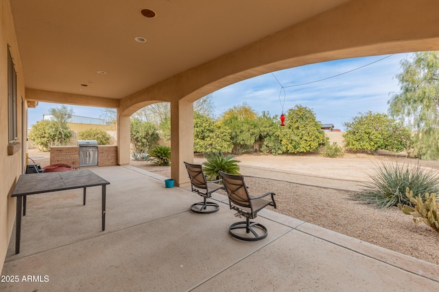 view of patio with exterior kitchen and area for grilling