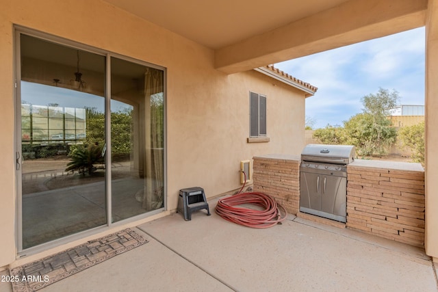 view of patio with a grill and exterior kitchen