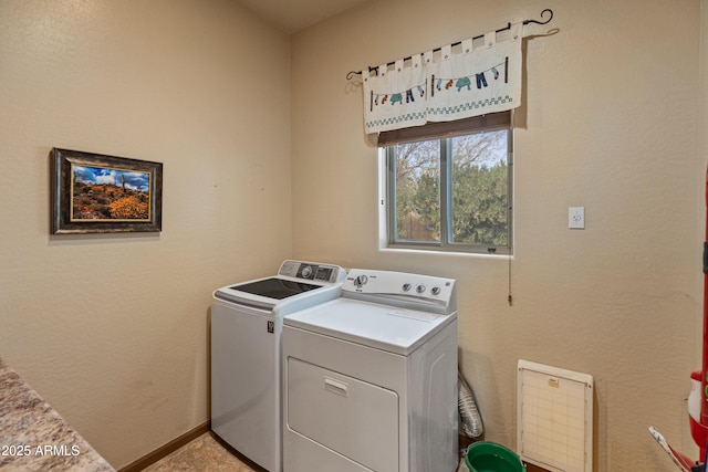 washroom with washing machine and dryer