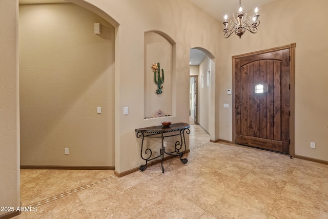 entrance foyer with a notable chandelier