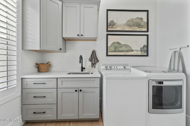 laundry area with cabinet space and washing machine and dryer