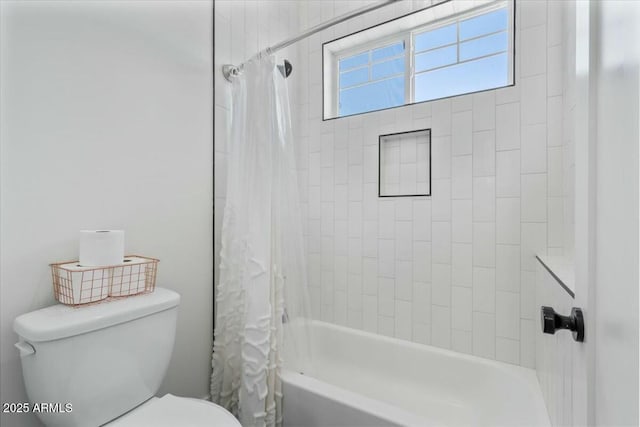 full bathroom featuring toilet and shower / bath combination with curtain