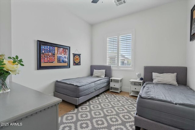 bedroom featuring light wood finished floors and ceiling fan