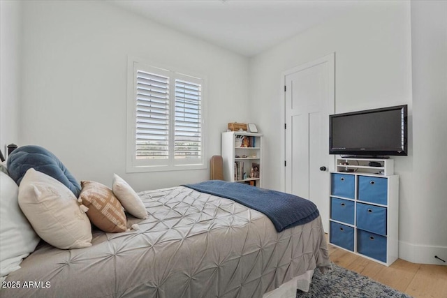 bedroom featuring wood finished floors