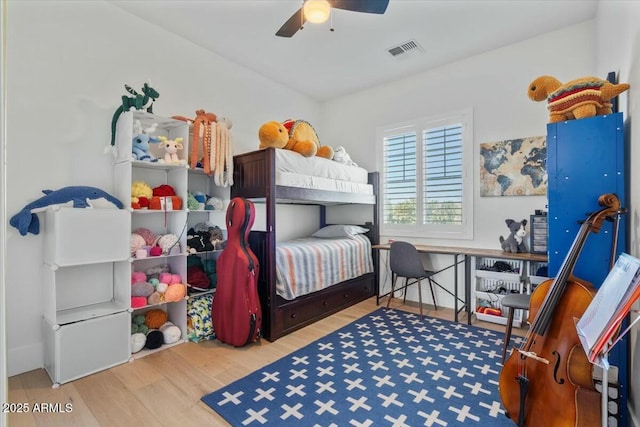 bedroom with wood finished floors and a ceiling fan