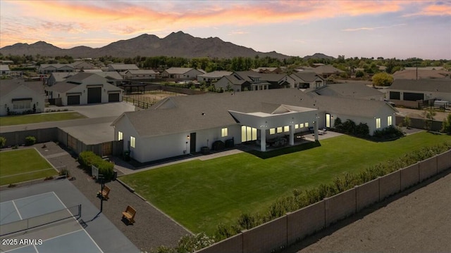 aerial view at dusk of a residential view and a mountain view