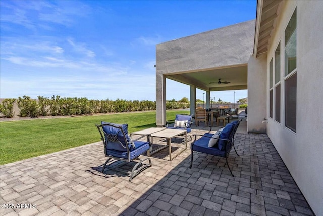 view of patio / terrace with ceiling fan and outdoor lounge area