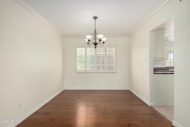 2547 W Naranja Ave, Mesa, AZ 85202 - empty room featuring a chandelier, plenty of natural light, wood finished floors, and ornamental molding