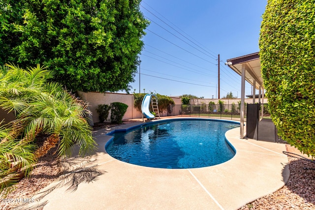 2547 W Naranja Ave, Mesa, AZ 85202 - view of pool featuring a water slide, a fenced backyard, and a patio