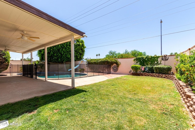 2547 W Naranja Ave, Mesa, AZ 85202 - fenced backyard with a ceiling fan and a patio area