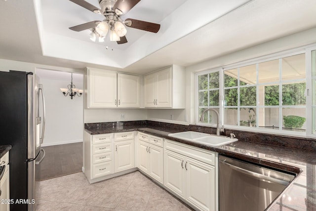 2547 W Naranja Ave, Mesa, AZ 85202 - kitchen featuring stainless steel appliances, a raised ceiling, white cabinetry, a chandelier, and dark stone counters