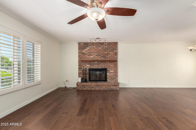 2547 W Naranja Ave, Mesa, AZ 85202 - unfurnished living room with wood finished floors, a fireplace, crown molding, rail lighting, and ceiling fan