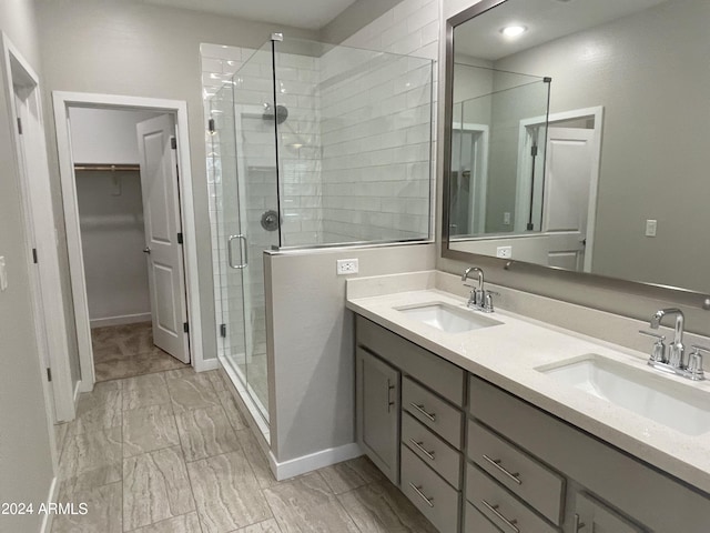 bathroom with vanity and an enclosed shower