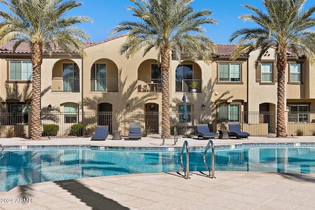 view of swimming pool featuring a patio