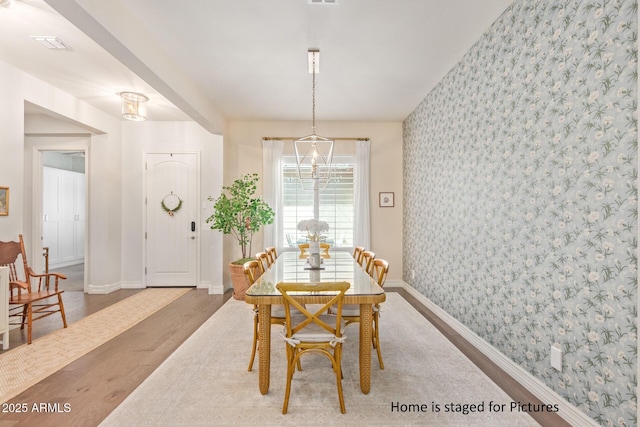 dining area with hardwood / wood-style floors