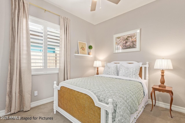 bedroom featuring ceiling fan and light colored carpet