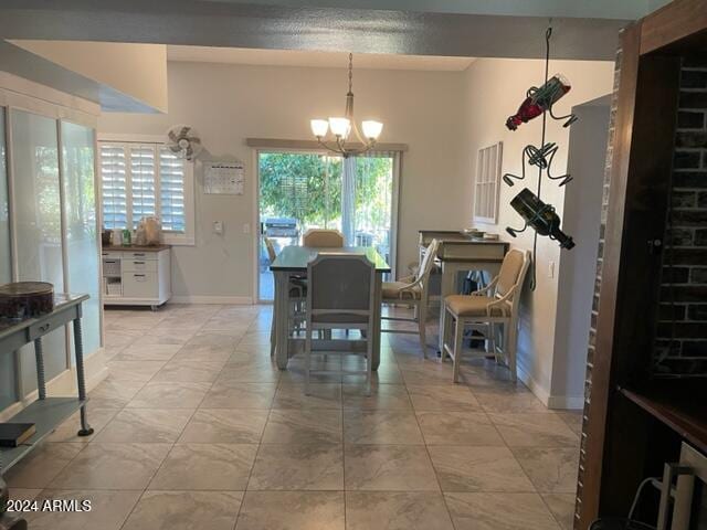 dining space featuring a notable chandelier